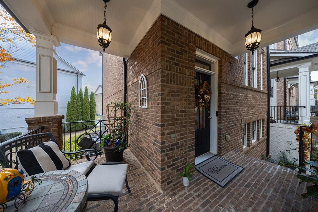 3908 Charleston Market Street Northwest Suwanee, GA 30024 - Photo 6 of 58 a outdoor living space with patio furniture