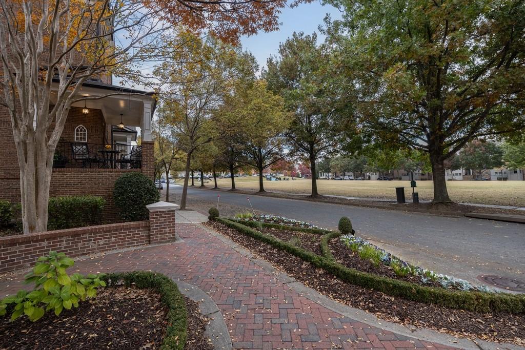 3908 Charleston Market Street Northwest Suwanee, GA 30024 - Photo 7 of 58 a view of a park with bench and trees