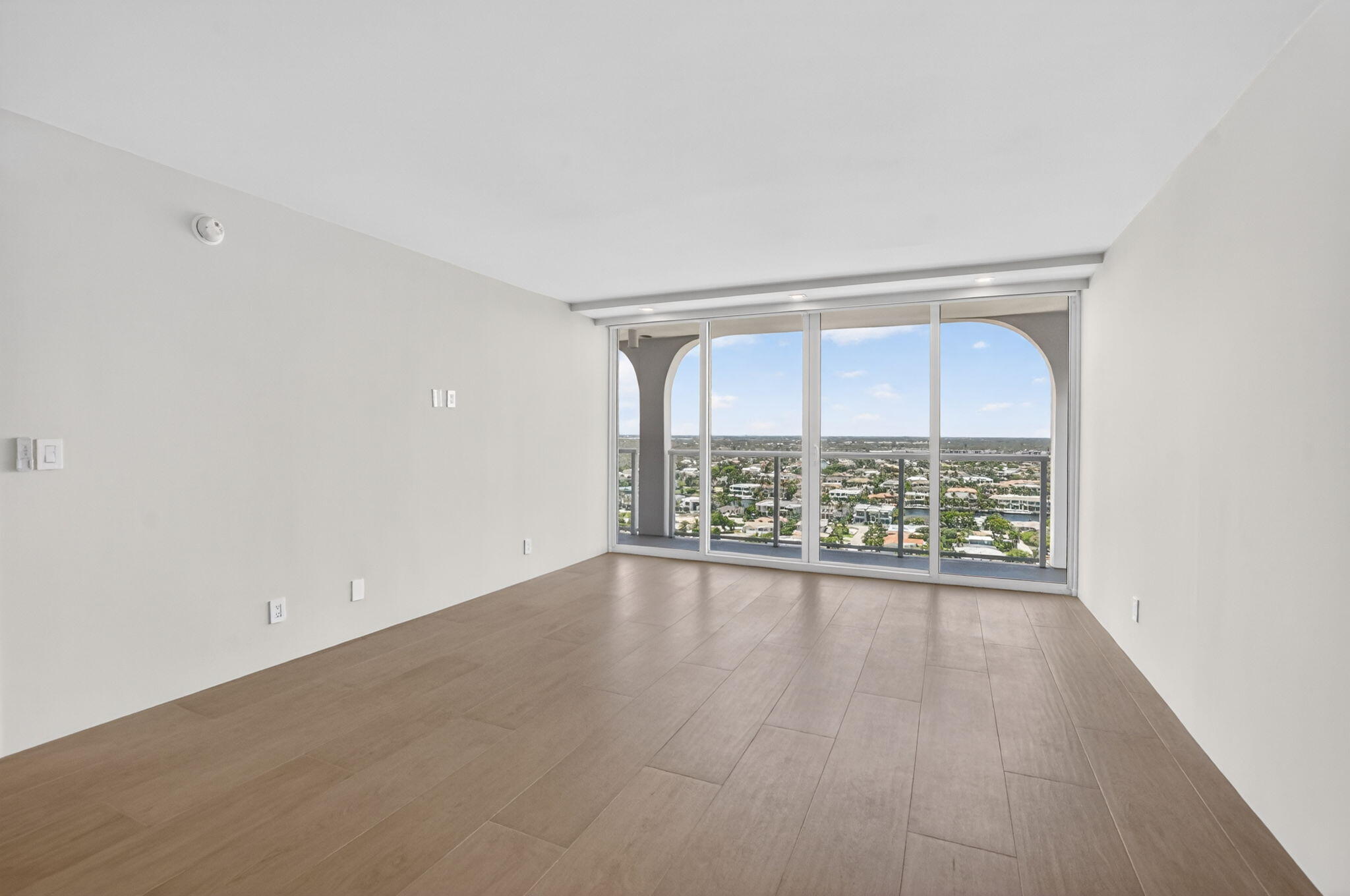 2800 South Ocean Boulevard, Unit 23C Boca Raton, FL 33432 - Photo 28 of 50 wooden floor in an empty room with a window