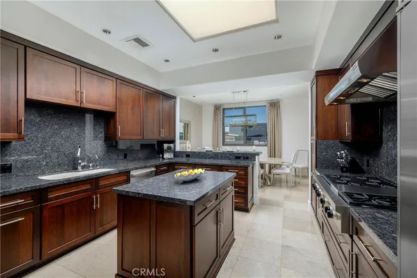 a stove top oven sitting inside of a kitchen