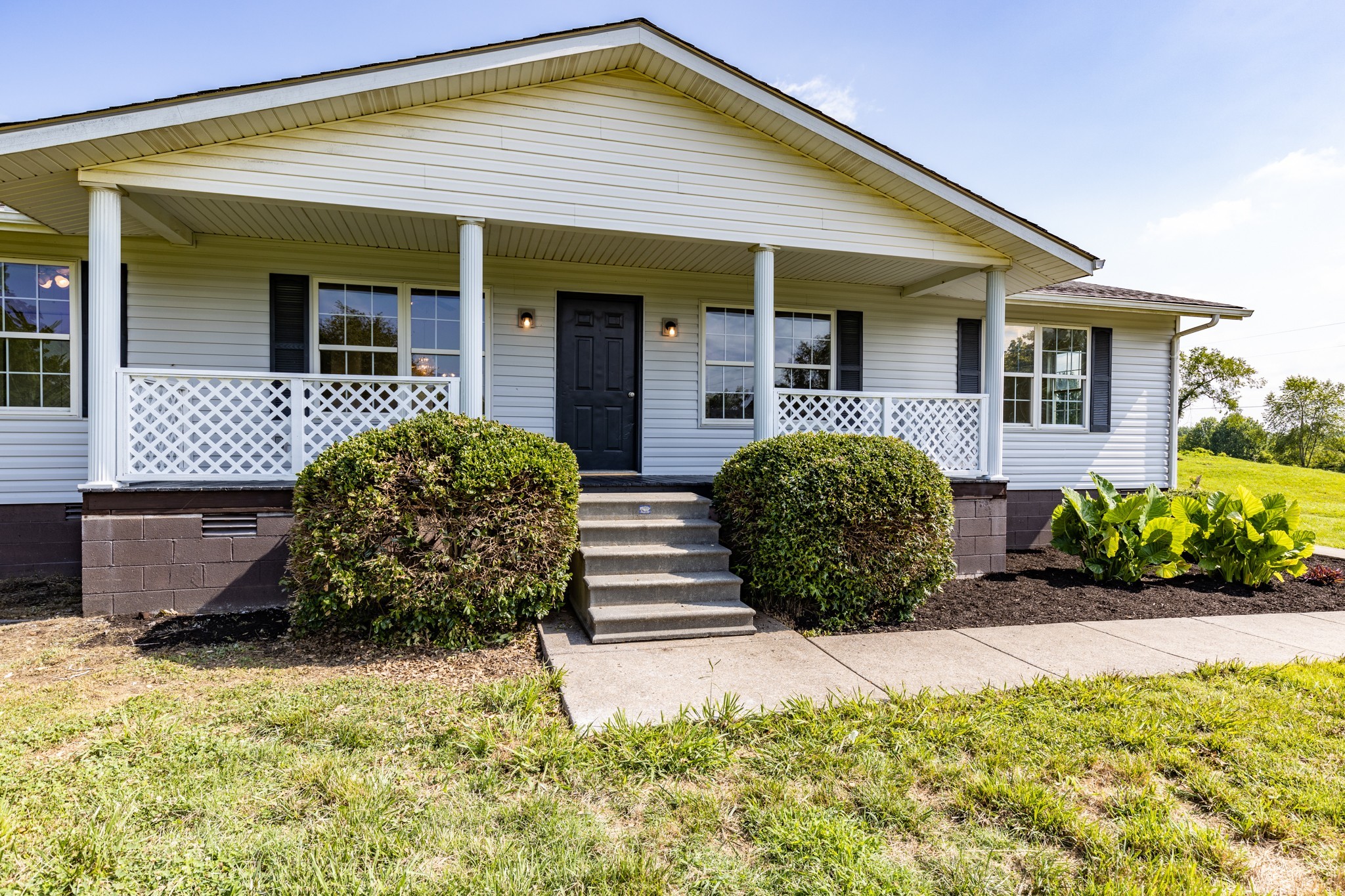 6665 Beasleys Bend Road Lebanon, TN 37087 - Photo 1 of 33 a front view of a house having yard