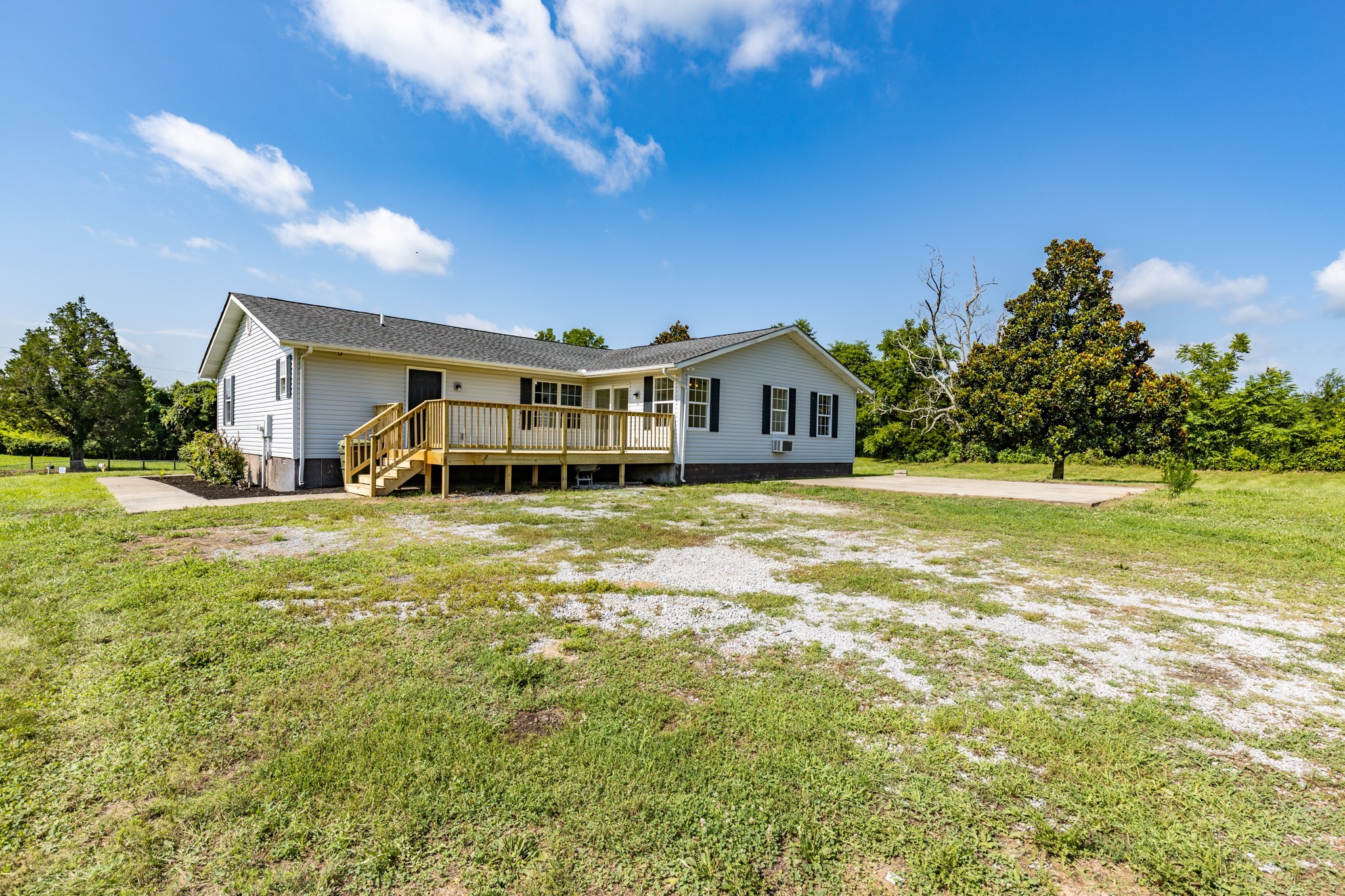 6665 Beasleys Bend Road Lebanon, TN 37087 - Photo 5 of 33 a view of a house with a big yard