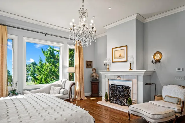 a bedroom with a bed and a fireplace