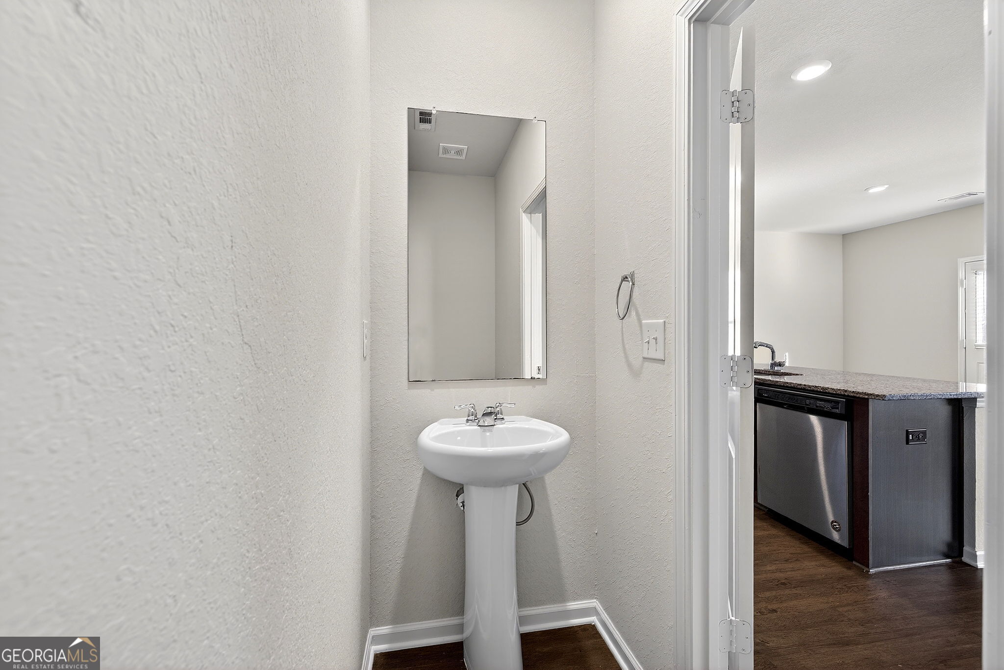 805 Golden Bell Way Villa Rica, GA 30180 - Photo 14 of 51 a bathroom with a sink and a mirror