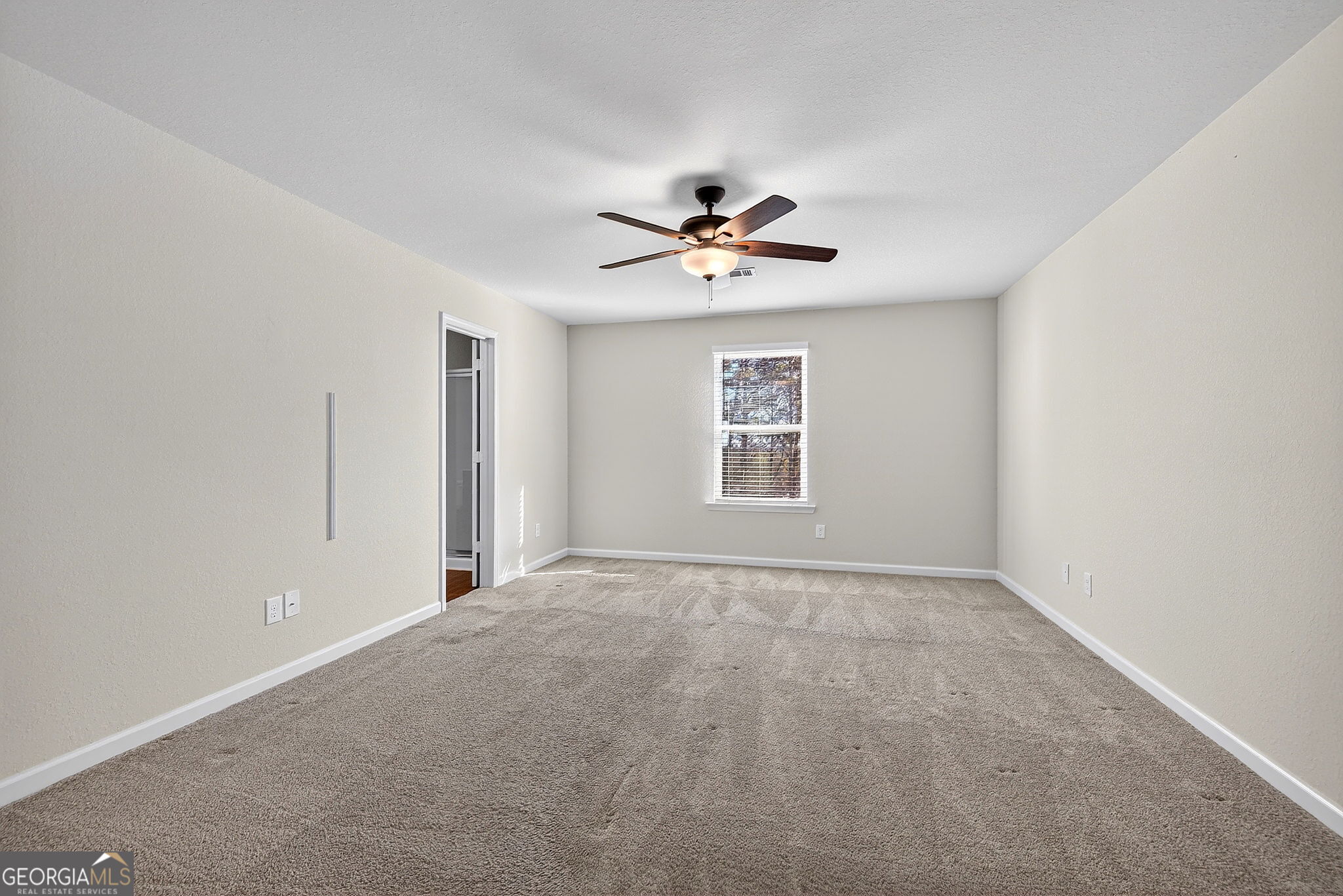 805 Golden Bell Way Villa Rica, GA 30180 - Photo 16 of 51 a view of an empty room with a window