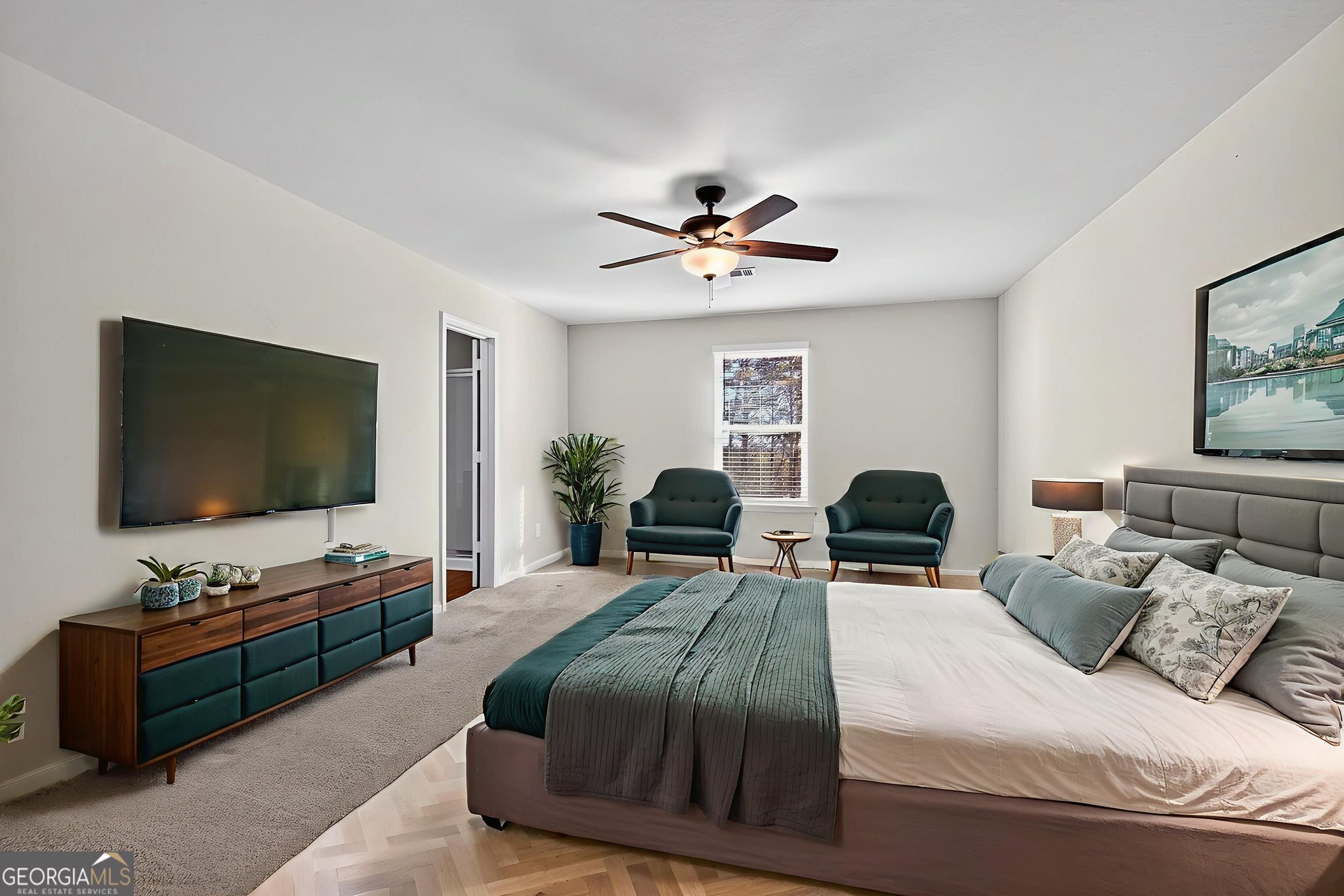 805 Golden Bell Way Villa Rica, GA 30180 - Photo 17 of 51 a bedroom with a bed and a flat screen tv