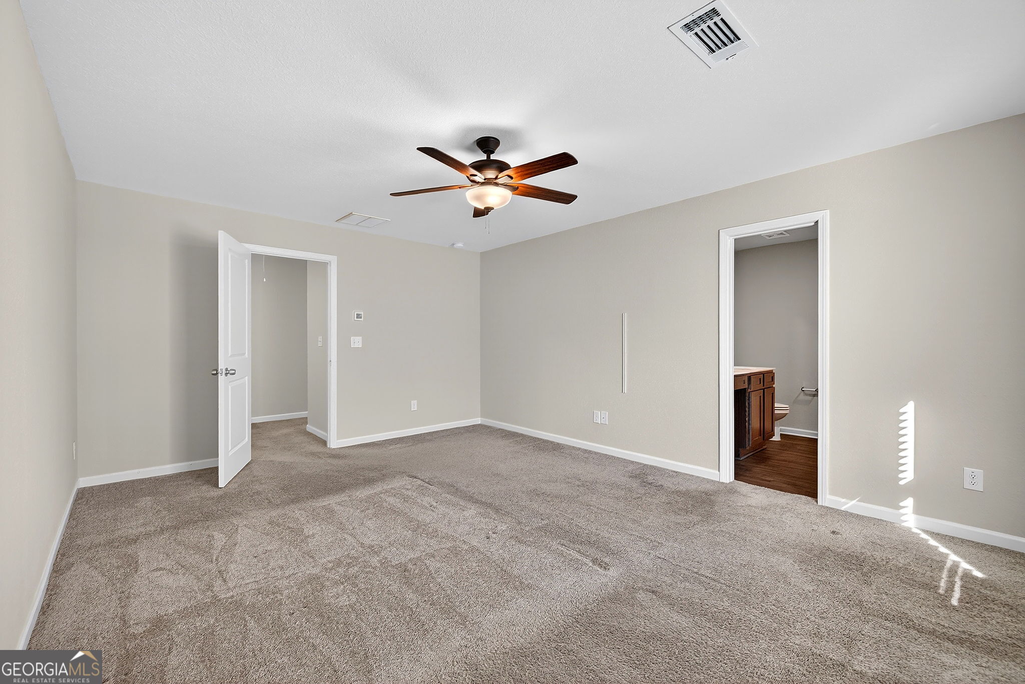 805 Golden Bell Way Villa Rica, GA 30180 - Photo 18 of 51 an empty room with closet and a ceiling fan