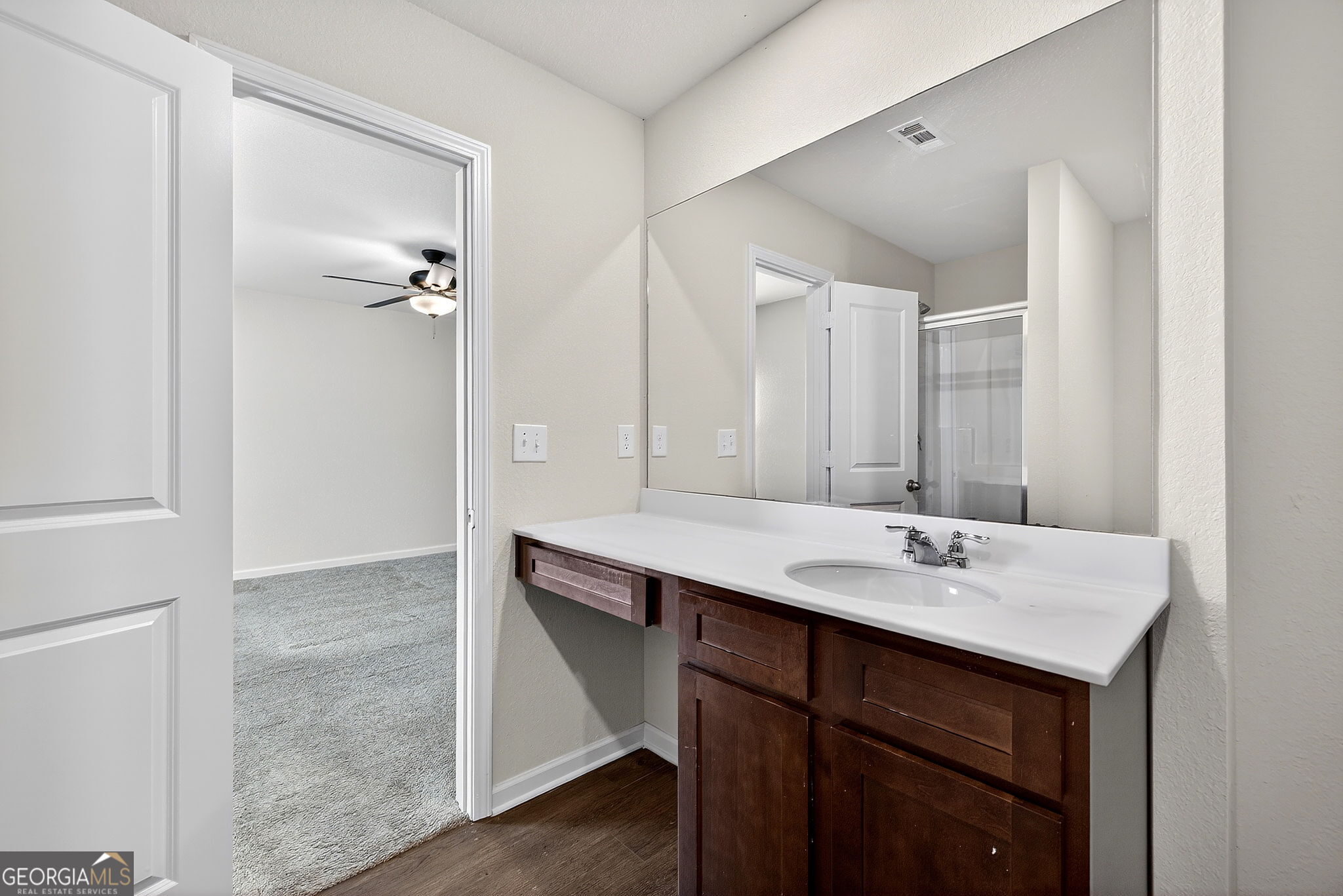 805 Golden Bell Way Villa Rica, GA 30180 - Photo 20 of 51 a bathroom with a sink and a mirror