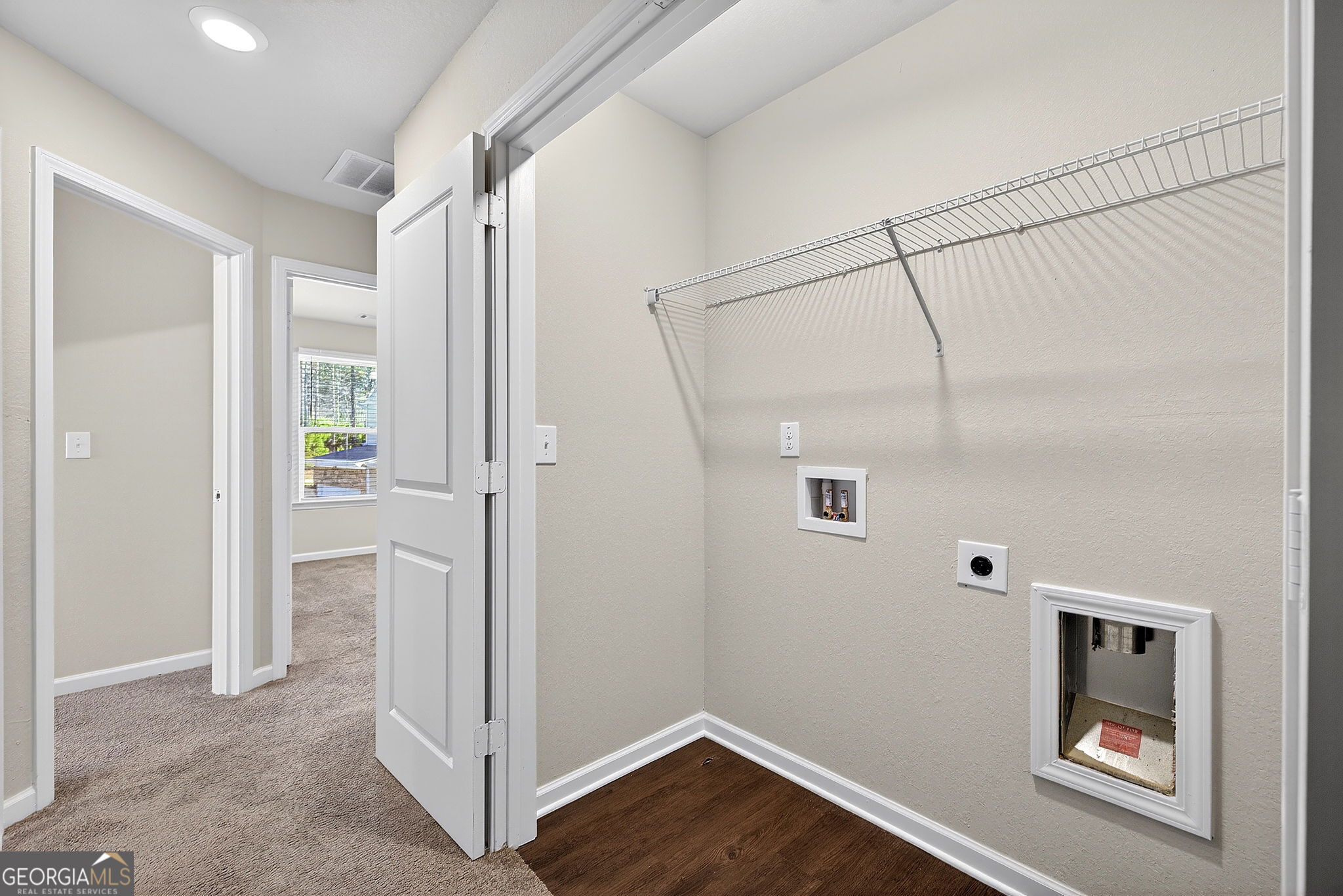 805 Golden Bell Way Villa Rica, GA 30180 - Photo 30 of 51 a view of storage and utility room with wooden floor