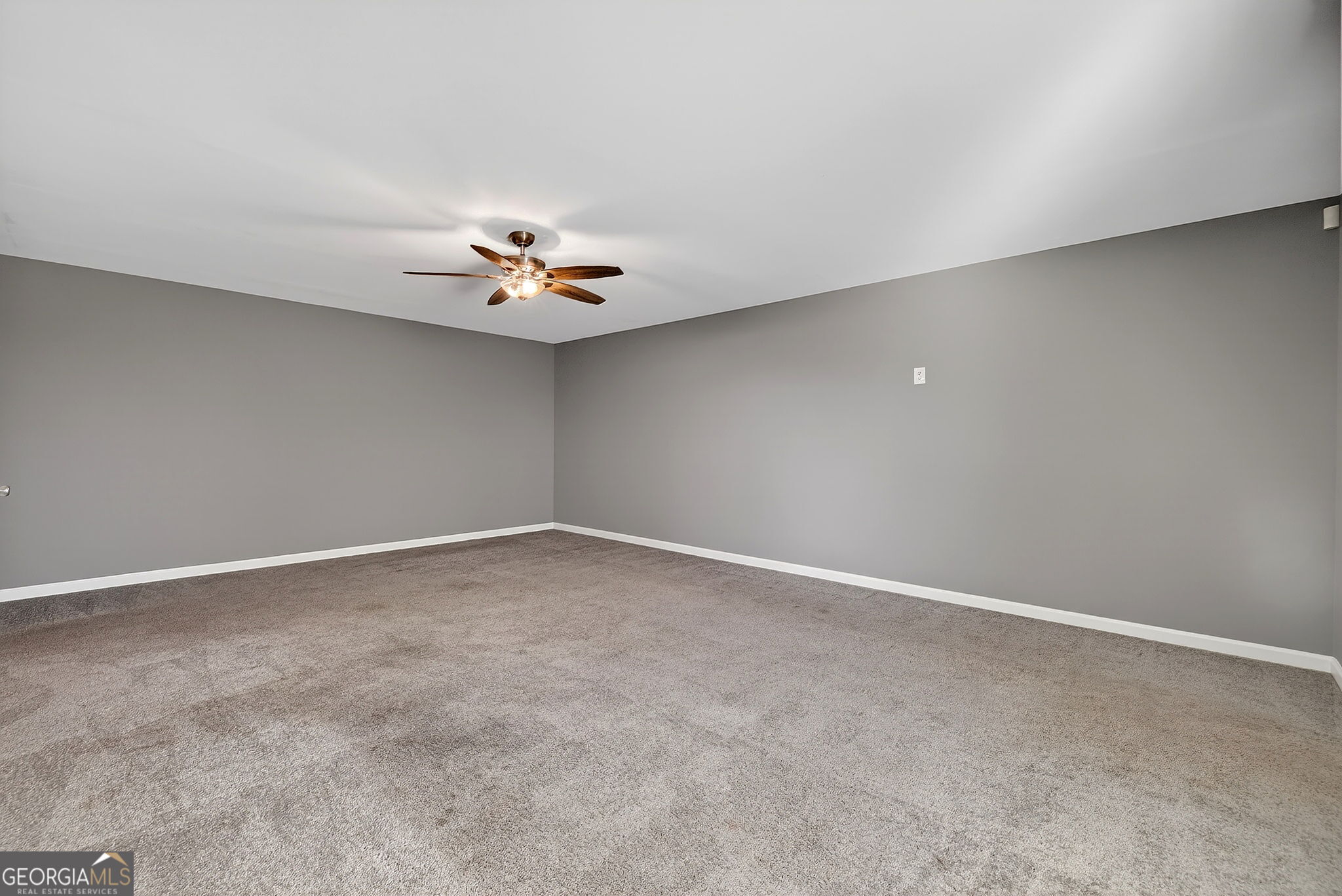 805 Golden Bell Way Villa Rica, GA 30180 - Photo 36 of 51 a view of an empty room with a ceiling fan