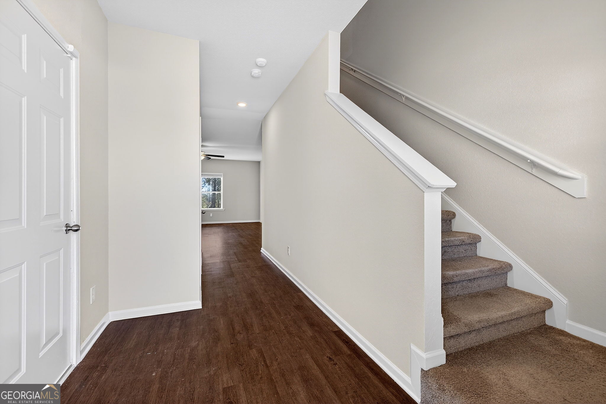 805 Golden Bell Way Villa Rica, GA 30180 - Photo 4 of 51 a view of a hallway with wooden floor and entryway