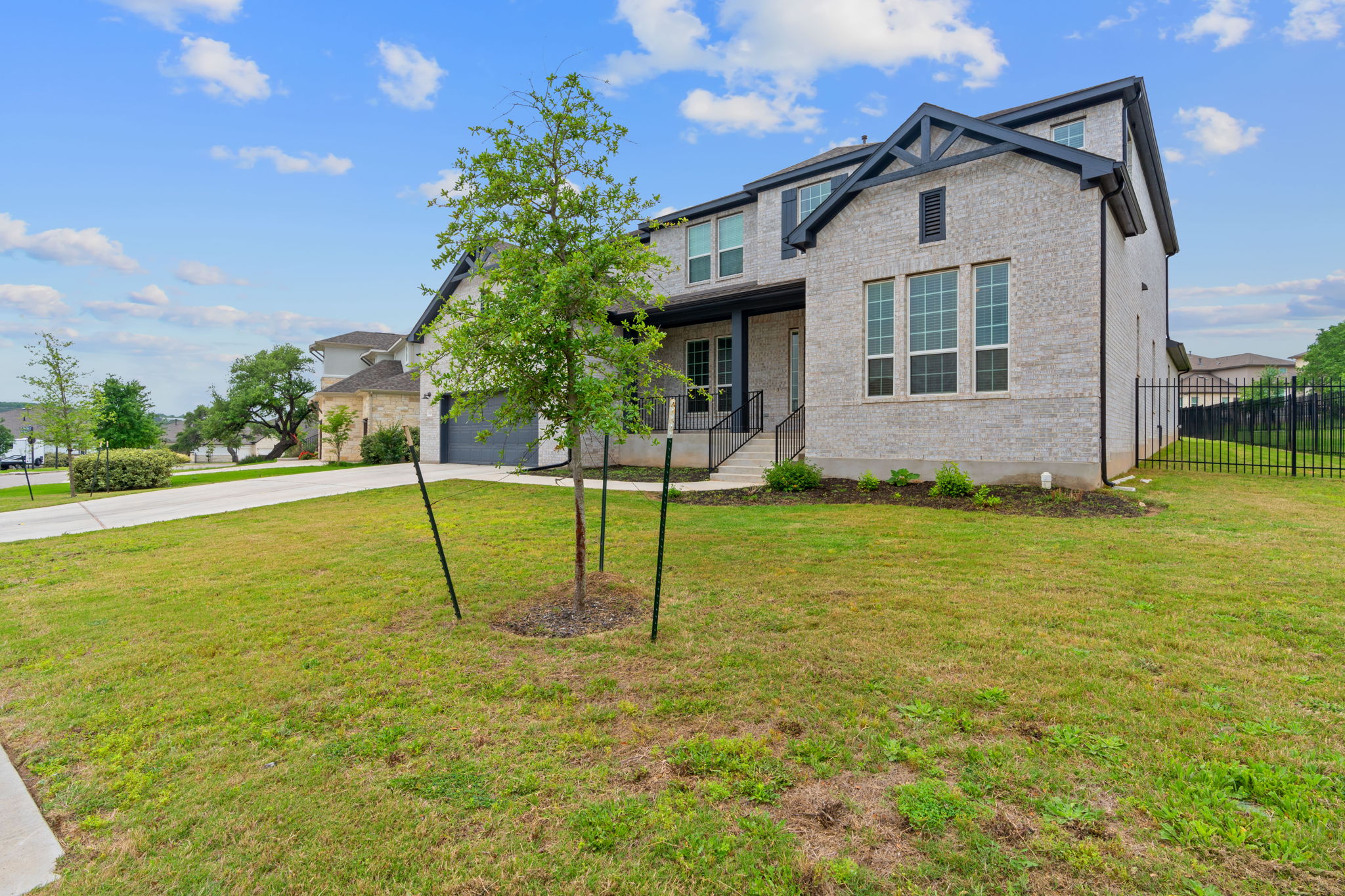 309 Pear Tree Lane Austin, TX 78737 - Photo 3 of 39 a view of a house with a yard