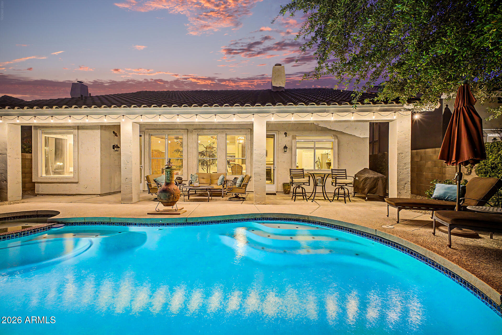 4309 East Rancho Caliente Drive Cave Creek, AZ 85331 - Photo 26 of 37 a view of a swimming pool with lounge chairs in front of house