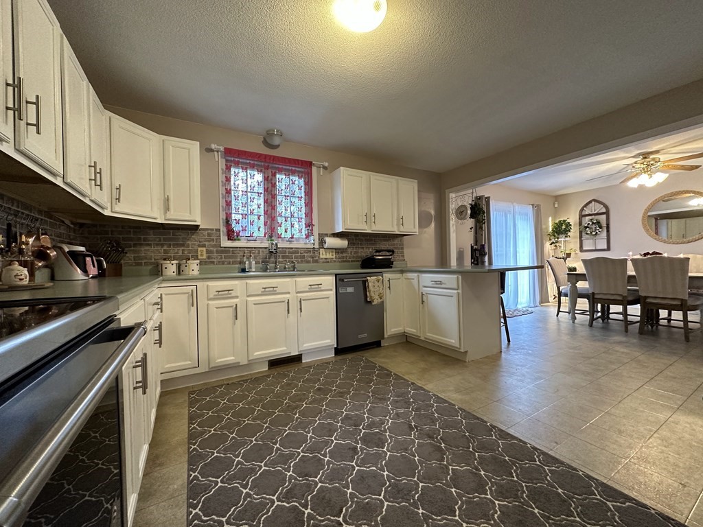 68 Lariviere Drive Chicopee, MA 01020 - Photo 17 of 42 a kitchen with a sink cabinets and window