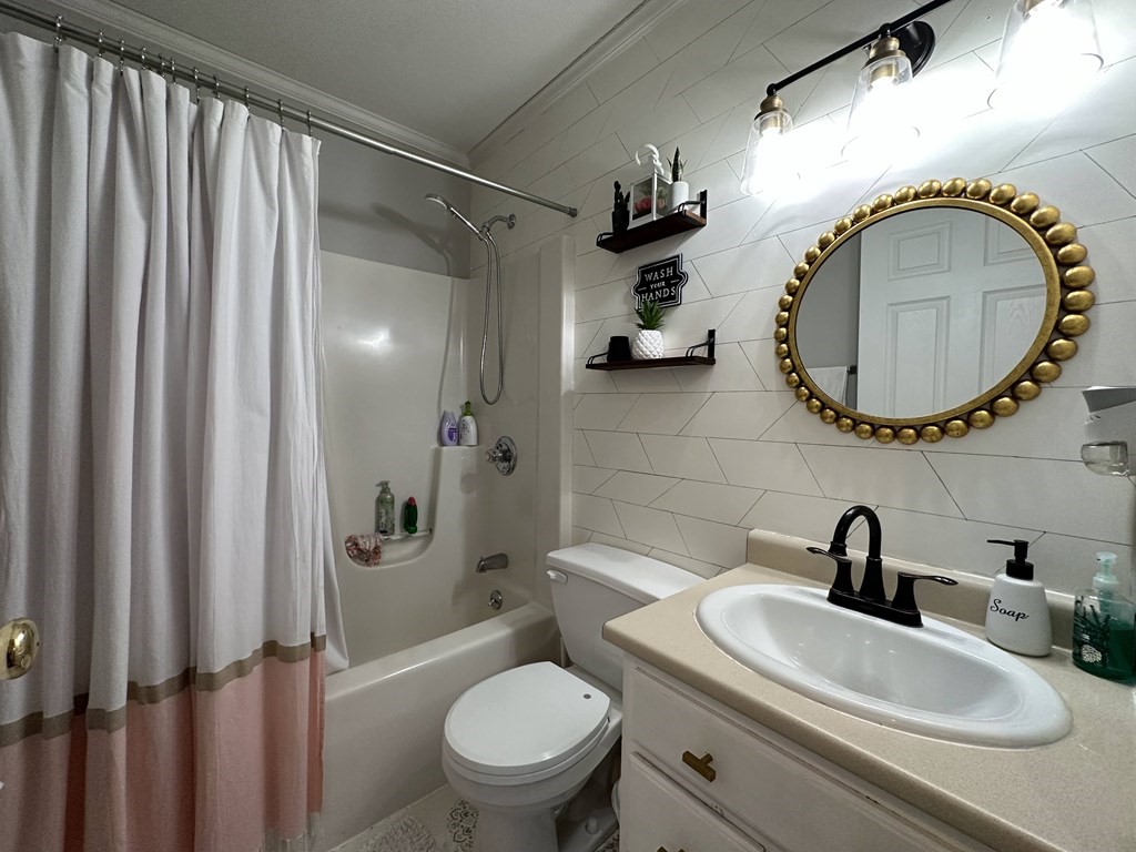 68 Lariviere Drive Chicopee, MA 01020 - Photo 20 of 42 a bathroom with a toilet a sink and a mirror
