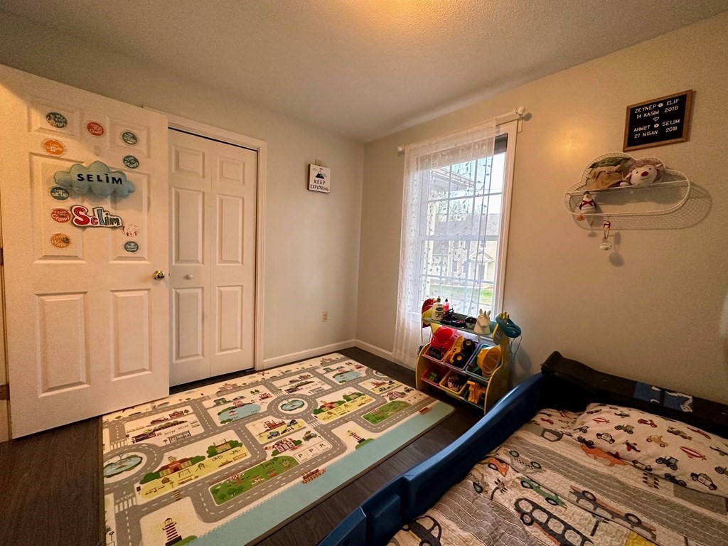 68 Lariviere Drive Chicopee, MA 01020 - Photo 22 of 42 a bed sitting in a bedroom next to a window