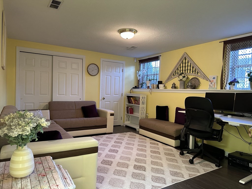 68 Lariviere Drive Chicopee, MA 01020 - Photo 31 of 42 a living room with furniture and a potted plant