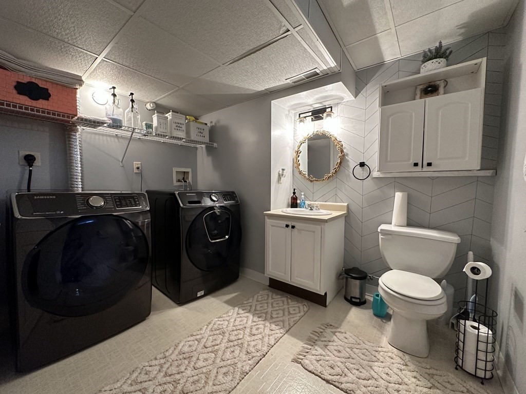 68 Lariviere Drive Chicopee, MA 01020 - Photo 37 of 42 a bathroom with a toilet sink and mirror