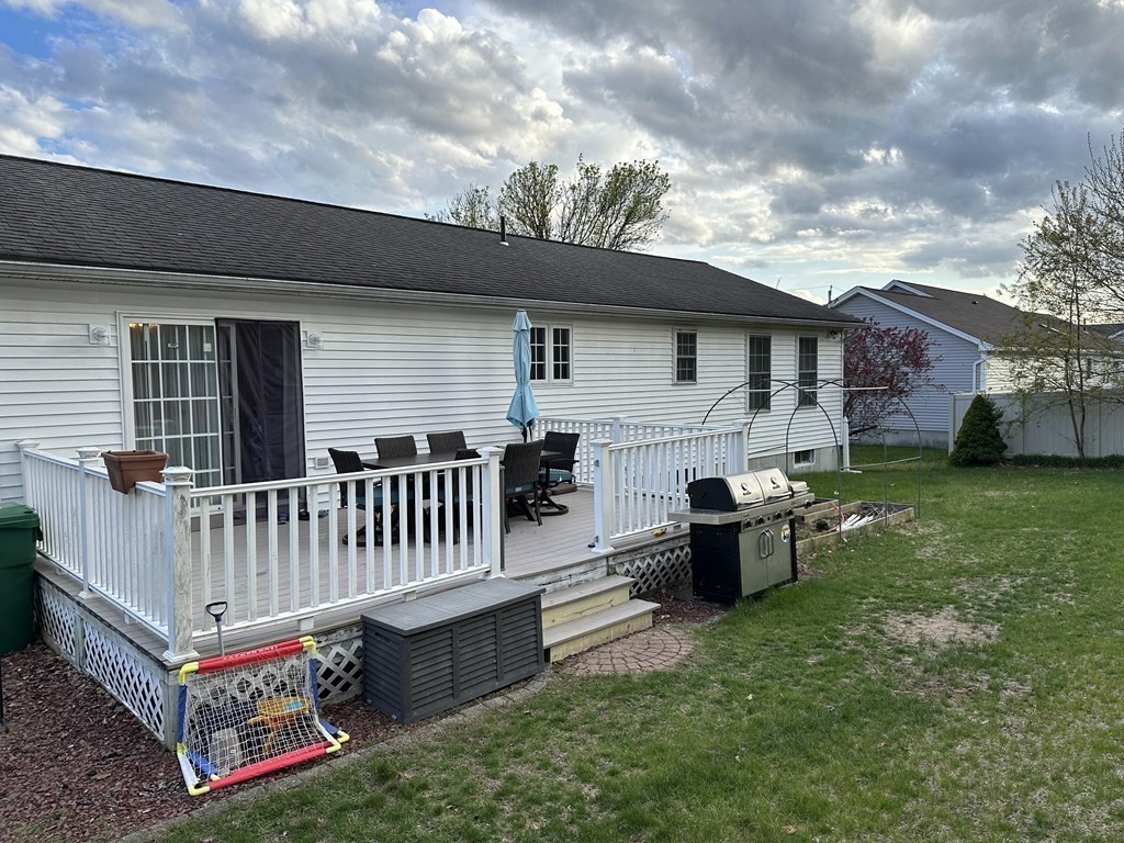 68 Lariviere Drive Chicopee, MA 01020 - Photo 4 of 42 a view of backyard with deck and garden