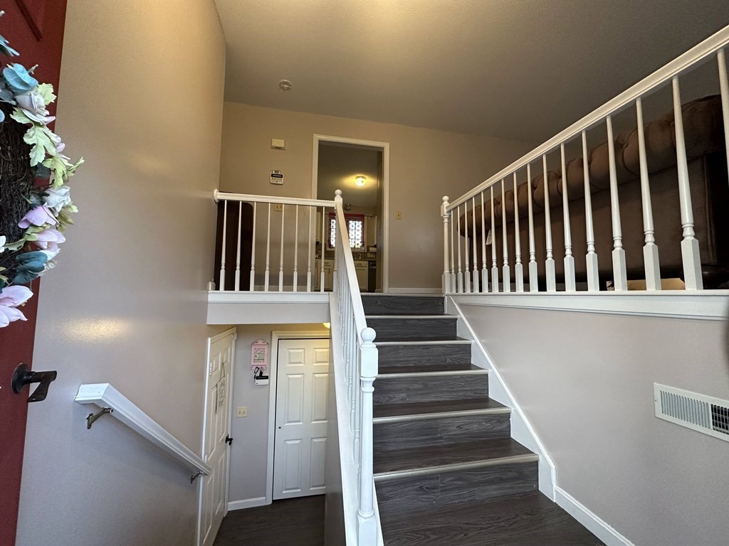68 Lariviere Drive Chicopee, MA 01020 - Photo 7 of 42 a view of entryway with wooden floor and stairs