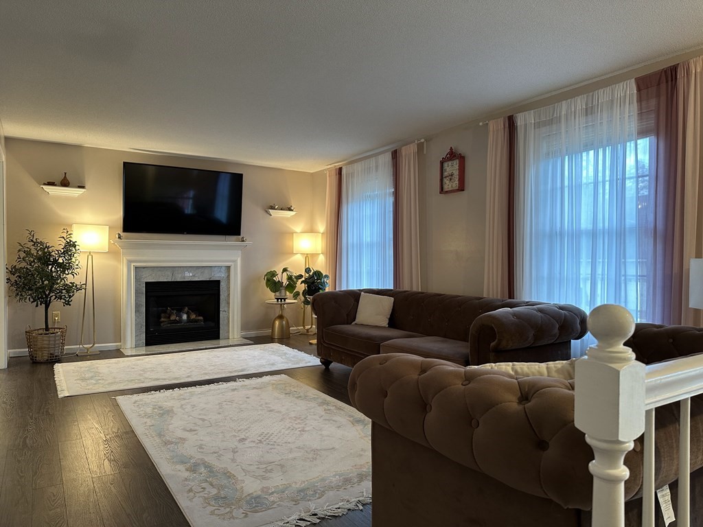 68 Lariviere Drive Chicopee, MA 01020 - Photo 8 of 42 a living room with furniture and a fireplace