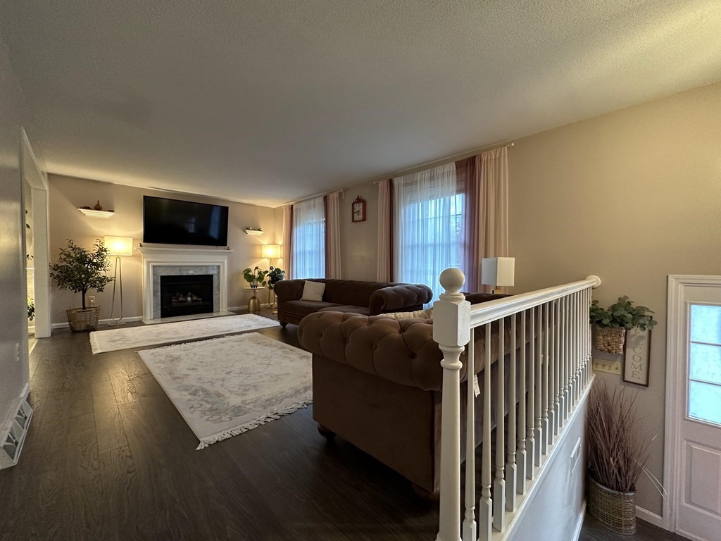 68 Lariviere Drive Chicopee, MA 01020 - Photo 9 of 42 a living room with furniture and a fireplace