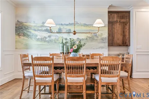 a large kitchen with kitchen island a sink stove and wooden cabinets