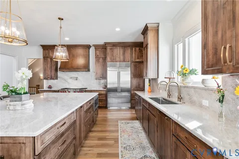 a kitchen with a sink and a refrigerator