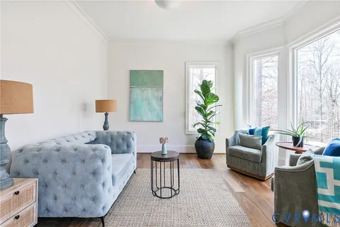 a spacious bathroom with a tub sink and mirror