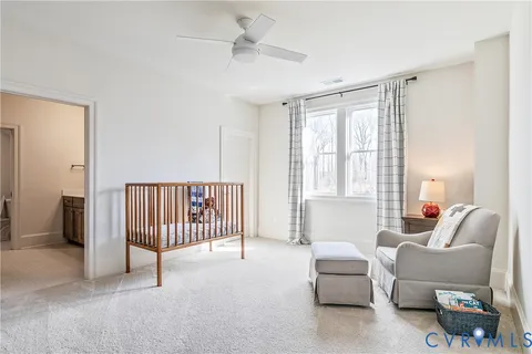 a kitchen with stainless steel appliances kitchen island granite countertop a refrigerator a stove a sink a dining table and chairs with wooden floor