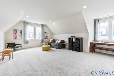 a bathroom with a shower sink vanity mirror and toilet