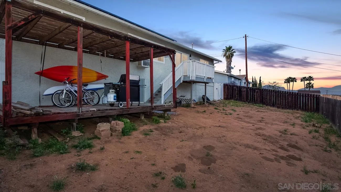 11739 Walnut Road Lakeside, CA 92040 - Photo 16 of 16 a view of a backyard with a patio and a garden