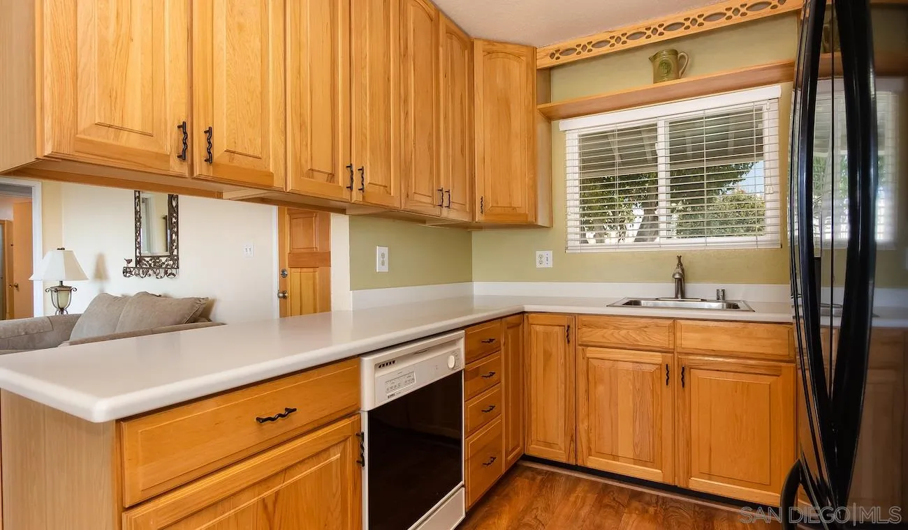 11739 Walnut Road Lakeside, CA 92040 - Photo 3 of 16 a kitchen with stainless steel appliances granite countertop a sink and cabinets