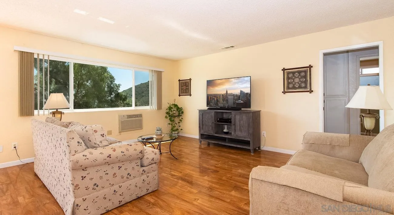 11739 Walnut Road Lakeside, CA 92040 - Photo 5 of 16 a living room with furniture and a flat screen tv