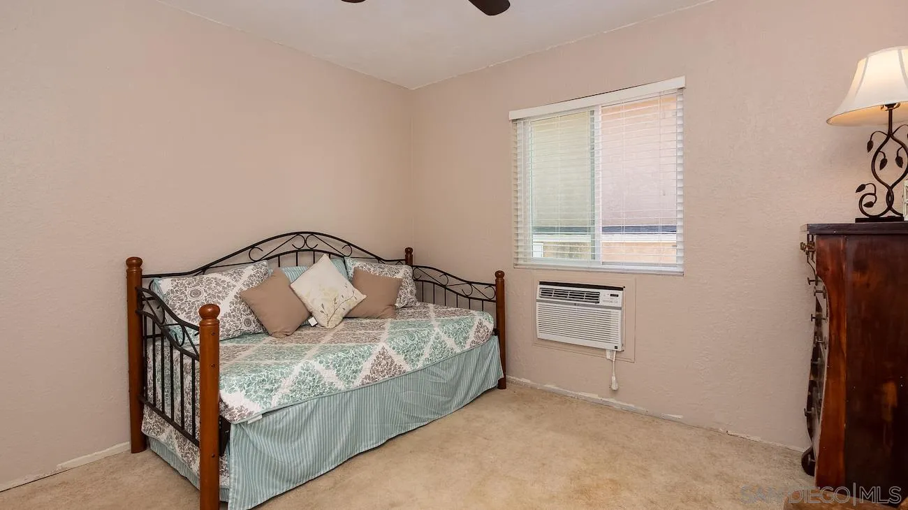 11739 Walnut Road Lakeside, CA 92040 - Photo 7 of 16 a bedroom with a bed and a window