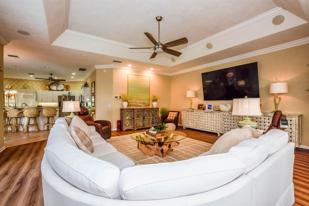 429 Tremingham Way Venice, FL 34293 - Photo 17 of 73 a living room with furniture and a flat screen tv