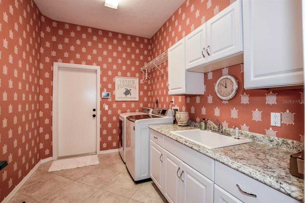 429 Tremingham Way Venice, FL 34293 - Photo 34 of 73 a bathroom with a sink and a mirror