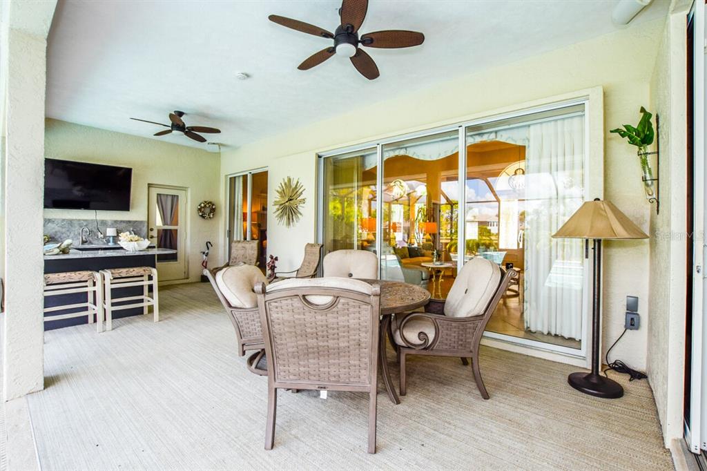 429 Tremingham Way Venice, FL 34293 - Photo 36 of 73 a dining room with furniture window and a flat screen tv