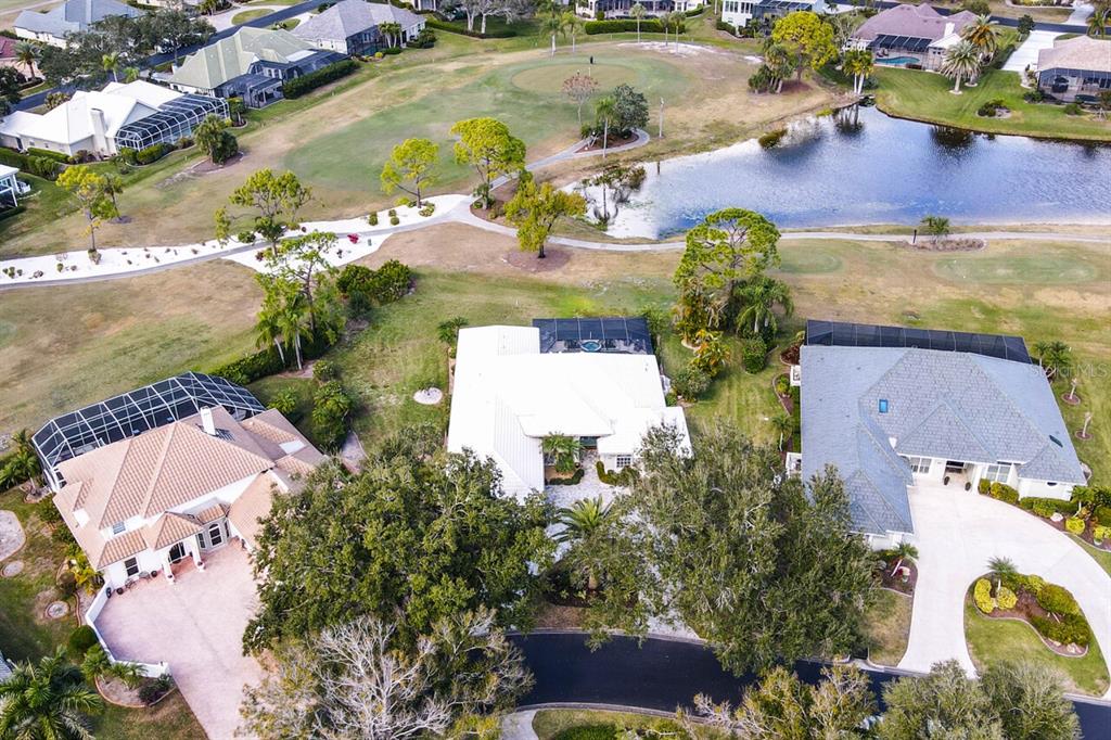 429 Tremingham Way Venice, FL 34293 - Photo 51 of 73 an aerial view of a house with a lake view