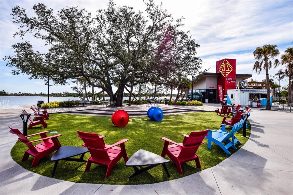 429 Tremingham Way Venice, FL 34293 - Photo 70 of 73 a view of yard with swimming pool and outdoor seating