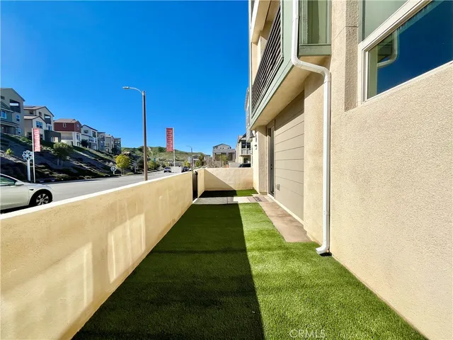 a view of a swimming pool with a yard