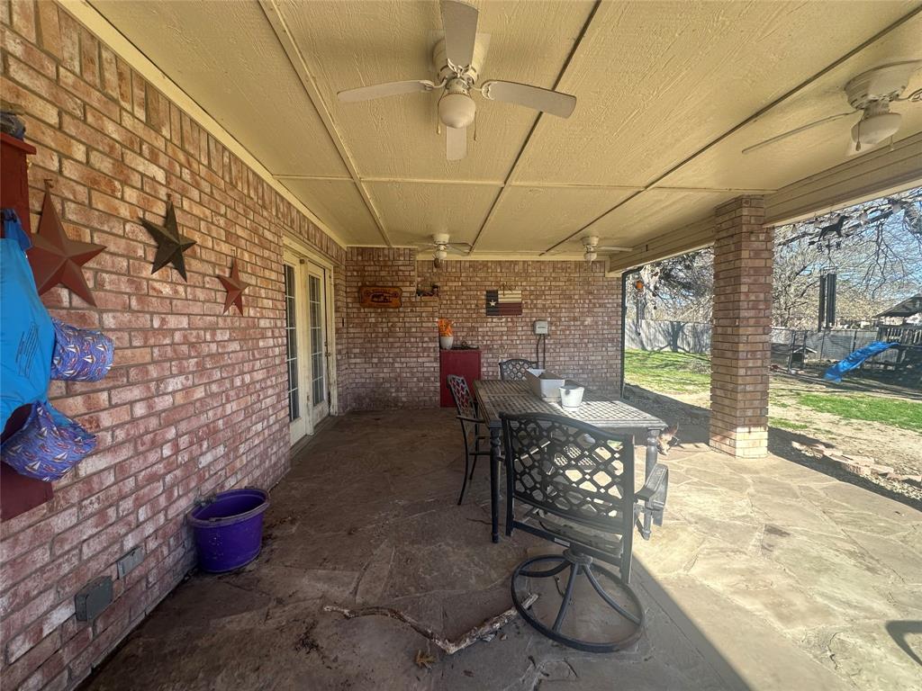 2020 Arbor Bend Road Bonham, TX 75418 - Photo 5 of 7 a view of a patio with table and chairs potted plants