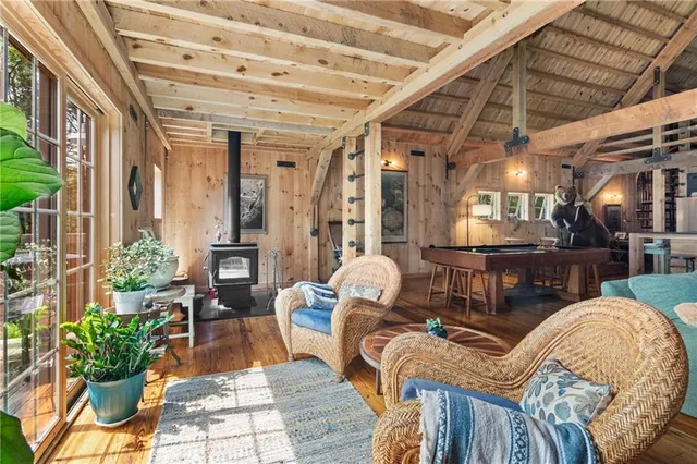 a outdoor living area with furniture and a fireplace