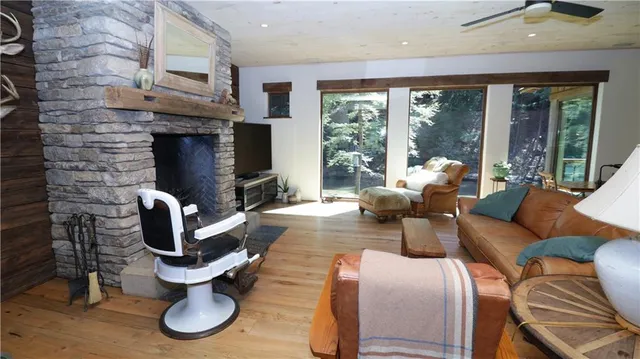 a living room with furniture fireplace and flat screen tv