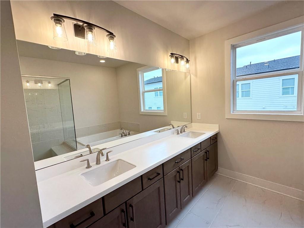 1237 Waldon Crossing Cumming, GA 30041 - Photo 14 of 29 a bathroom with a sink double vanity and a mirror