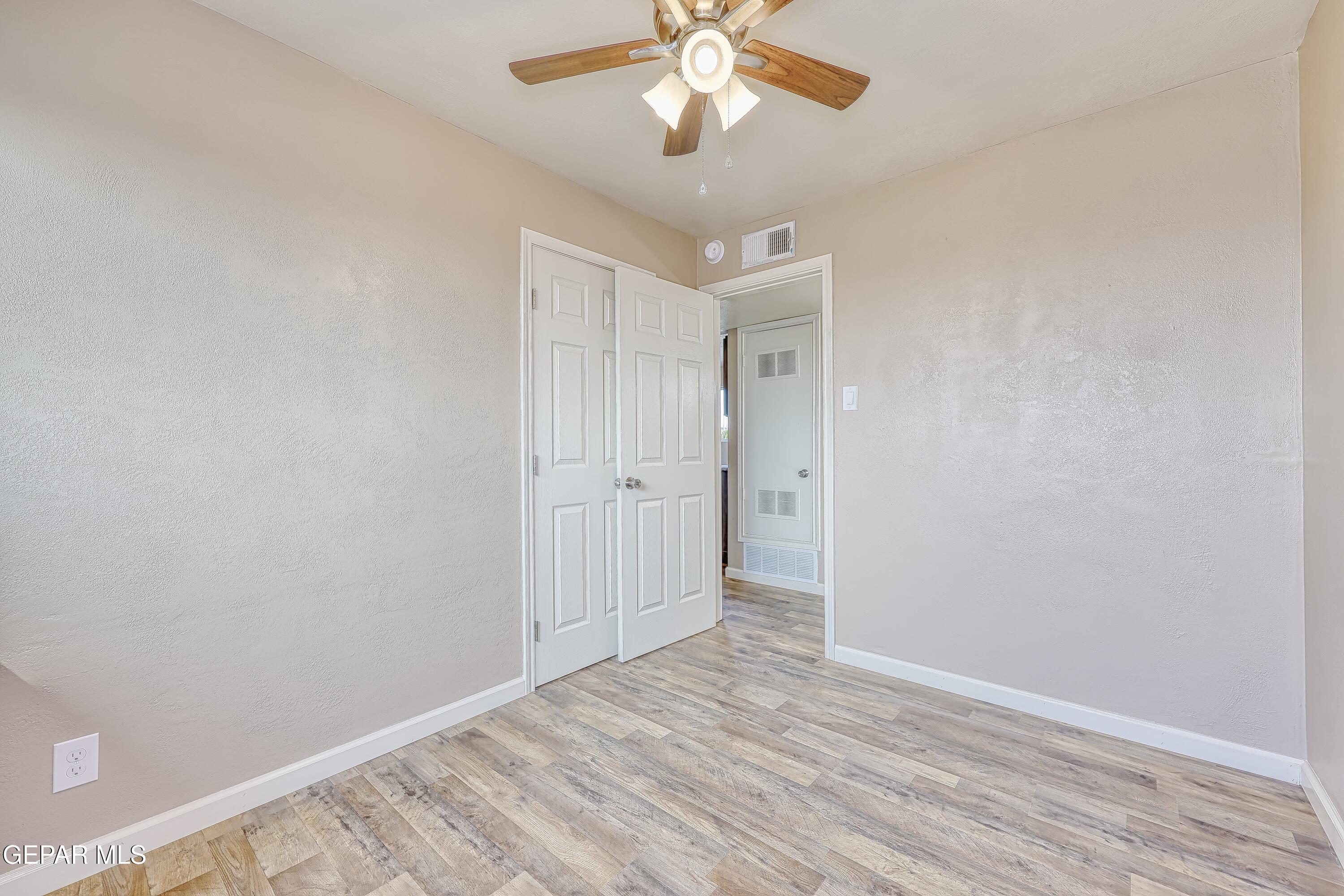7212 Raton Drive El Paso, TX 79915 - Photo 18 of 44 wooden floor in an empty room with a window