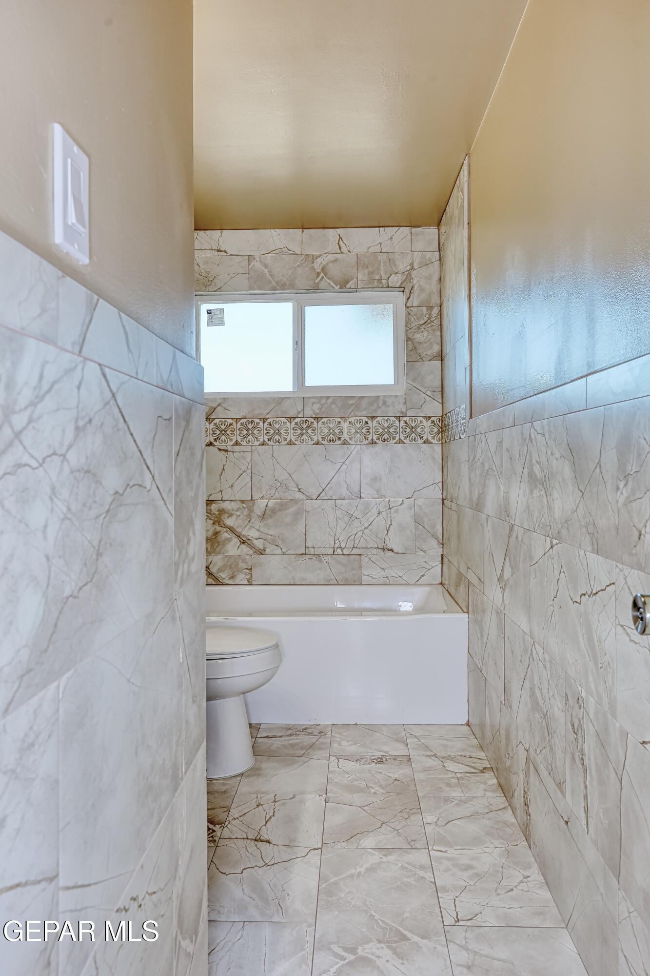 7212 Raton Drive El Paso, TX 79915 - Photo 19 of 44 a bathroom with a bathtub and shower