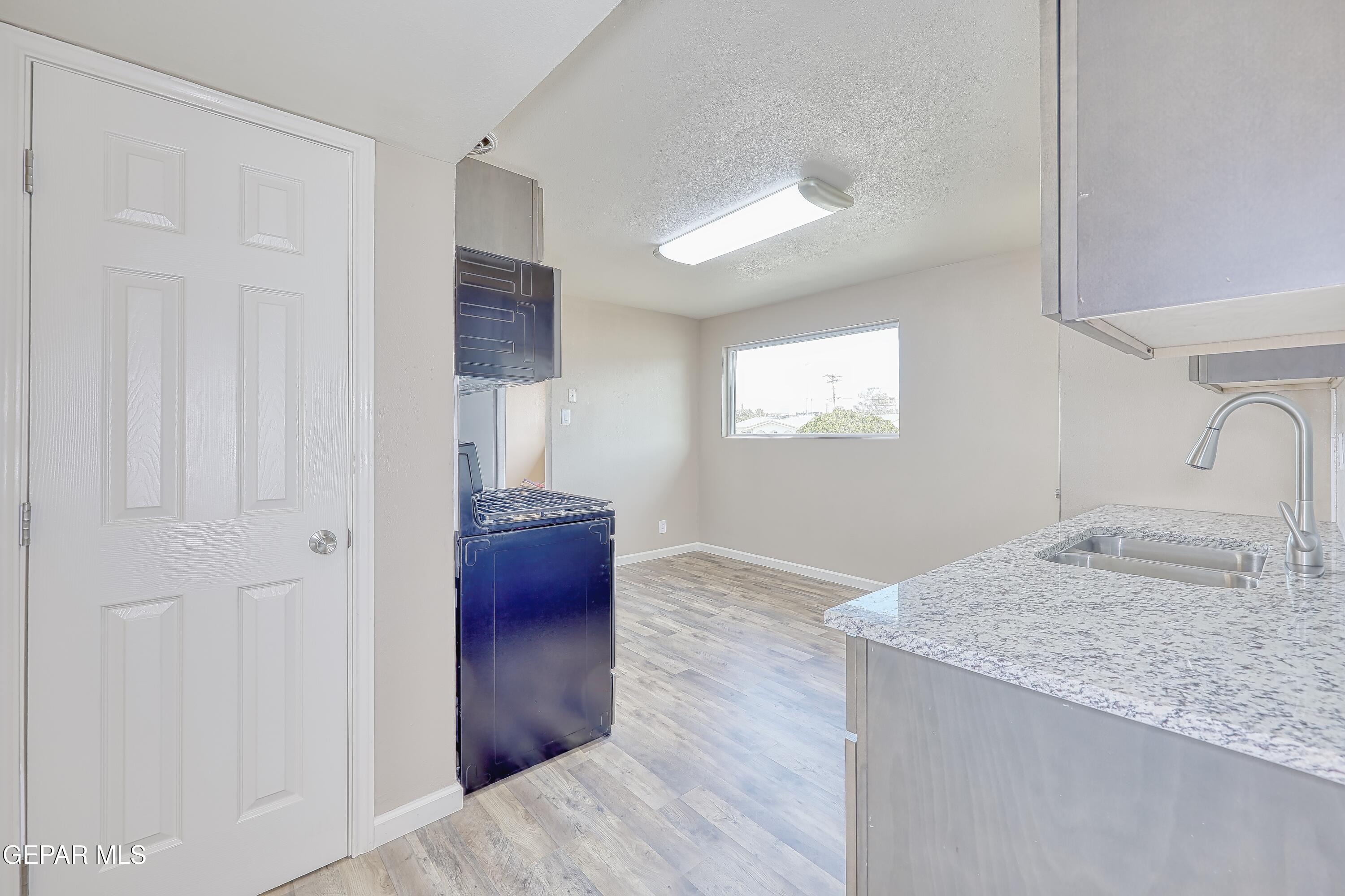 7212 Raton Drive El Paso, TX 79915 - Photo 26 of 44 a view of kitchen and hallway