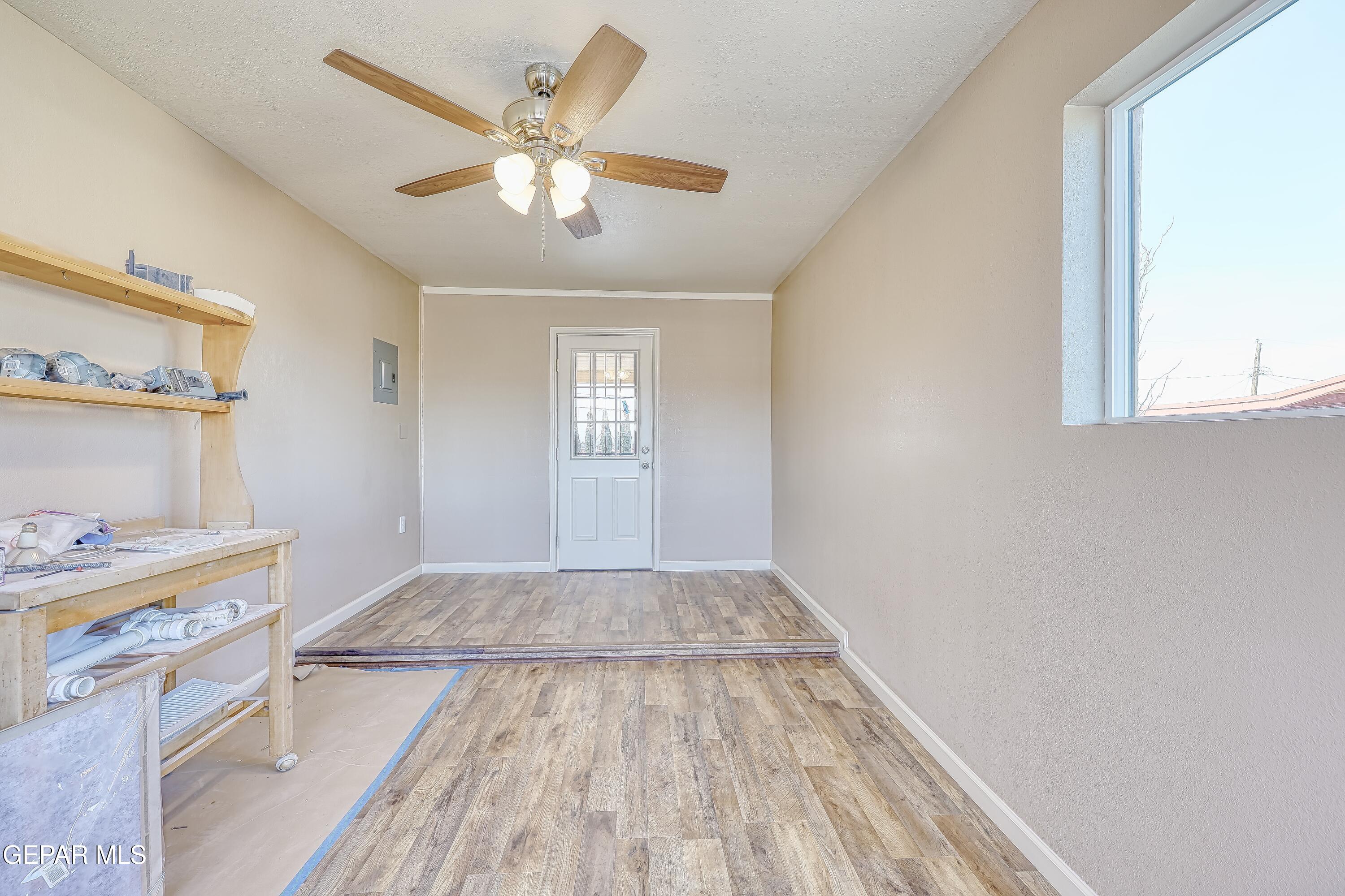 7212 Raton Drive El Paso, TX 79915 - Photo 32 of 44 wooden floor in an empty room with a window