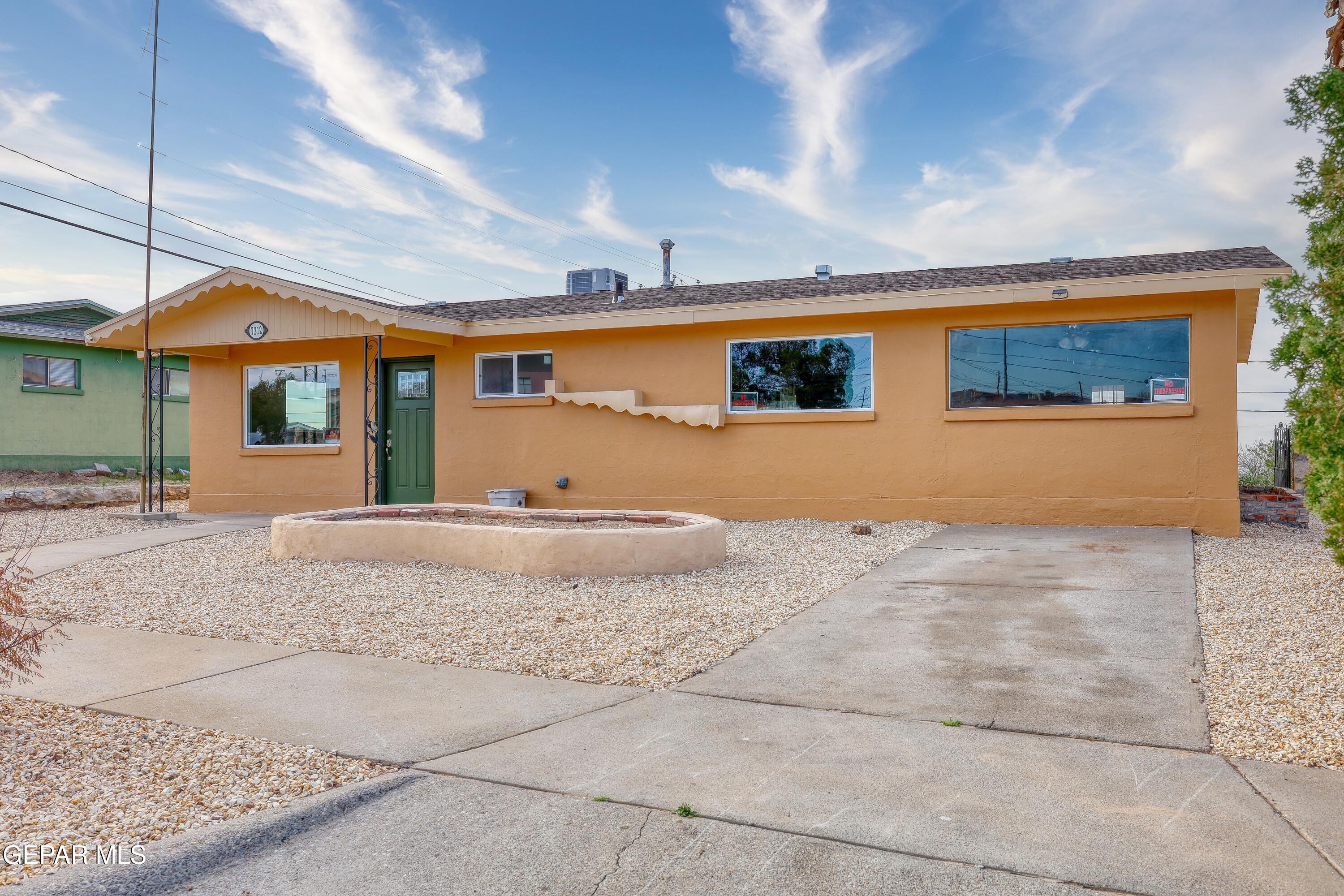 7212 Raton Drive El Paso, TX 79915 - Photo 7 of 44 a front view of a house with a yard and garage